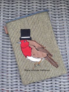 a small pouch with a bird on it