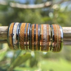 a stack of wooden rings sitting on top of a tree branch