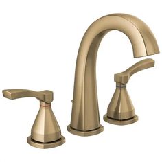 two handle bathroom faucet in brushed brass with matching handles and levered spout