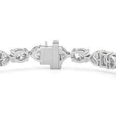 An exceptionally beautiful piece of jewelry infused with sentimentality. This tennis bracelet presents a dazzling pattern of oval, heart, and emerald-cut diamonds. It features emerald-cut diamonds set in between charming heart-shaped diamonds. Emerald-cut diamonds add a nostalgic flair to this piece. Elegant Heart Cut Diamond Bracelet, Luxury Silver Diamond Heart Bracelet, Classic Diamond Heart Bracelet In White Gold, Elegant Diamond Bracelet With Heart Cut, Elegant Diamond Heart Bracelet With Brilliant Cut, Classic White Gold Diamond Heart Bracelet, Elegant Diamond Heart Cut Bracelets, Luxury Diamond Heart Bracelet With Accents, Luxury White Gold Heart Bracelet With Diamonds