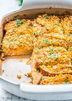 a casserole dish with meat and cheese in it on a white counter top