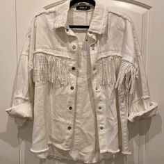 Nwt Stitch + Feather Shacket. White Oversized Jean Jacket With Fringe. Silver Studded Accents On Fringe And Collar. Button Up Shacket. Intentionally Minimal Frayed Bottom And Along Collar. New With Tags, Never Worn And In Perfect Condition. Blue B Brand But Bought From Stitch & Feather (Stitch And Feather) Boutique. Size Small. Please Leave Any Questions Below. Offers Are Welcomed:) I Can Ship Asap Oversized Long Sleeve Fringe Outerwear, Cream Long Sleeve Fringe Outerwear, Casual White Outerwear With Frayed Hem, Spring Cream Outerwear With Fringe, Cream Fringe Outerwear For Spring, Spring Cream Fringe Outerwear, Jean Jacket With Fringe, Long Distressed Denim Jacket, Trucker Jacket Women