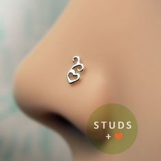 an earring with the word studs on it