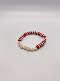 Handmade 7.5 in. preppy beaded bracelet. Contains white, and red 6mm beads, also has gold letter beads . I can custom create a bracelet for you. Just let me know what colors you want, and if you want a word on your bracelet. I can also make phone charms and rings. Personalized Red Beaded Bracelets For Birthday, Red Beaded Bracelets With Letter Beads For Birthday, Red Personalized Friendship Bracelets, Personalized Red Friendship Bracelets For Everyday, Personalized Red Friendship Bracelets, Everyday Personalized Red Friendship Bracelets, Red Beaded Bracelet With Letter Beads For Holidays, White Beaded Bracelets With Letter Beads For Christmas, White Letter Beads Jewelry For Christmas