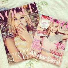 two magazines sitting on top of a bed next to each other with covers covering them