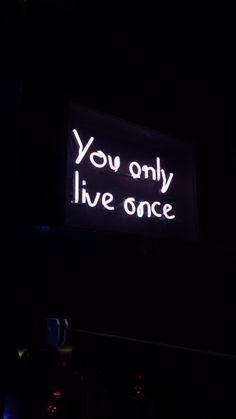 a neon sign that says you only live once