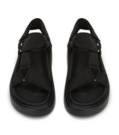 Trending now is the Jacamo sandal in black. This flatform features a strappy upper, ankle support and silver hardware. Perfect for long Summer days where both comfort and style are key. -Material: Man made -Sole: Man made -Fit: True to size -Toe-shape: Open -Features: Flatform