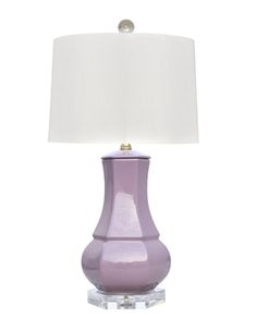 a purple lamp with a white shade on it