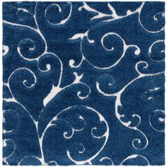 a blue rug with white swirls on the front and back of it's surface