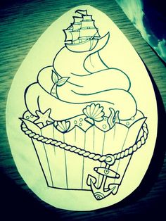 a drawing of a cupcake with a pirate ship on it and an anchor in the middle