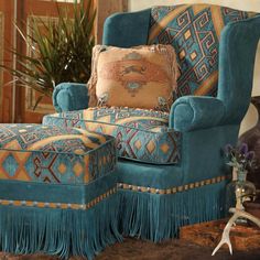 a blue chair and ottoman in a living room