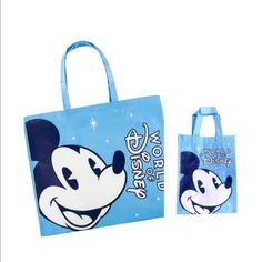 a mickey mouse shopping bag and tote bag are shown in front of a white background