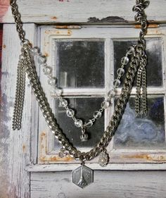 This is a fun eclectic double strand necklace. The Eiffel Tower Charm and the Crown are sterling silver. The perfect gift for that someone special. I T E M ∙ S P E C I F I C A T I O N S: - CHAIN LENGTH: Necklace is made with silver chain and crystal rosary bead chain. Silver chain is not sterling. Double Strand- Short strand is 20" in length, Longest Strand is 24" - you can link the clasp in another loop and make it shorter if you prefer. - PENDANT SIZE: Sterling Silver Crown is 1/2" long, Paris Silver Dangle Charm Necklace, Silver Layered Necklace As A Gift, Silver Double Chain Layered Necklace In Sterling Silver, Sterling Silver Double Strand Layered Necklace, Silver Multi-strand Necklace For Layering, Handmade Silver Layered Necklace For Gift, Handmade Silver Layered Necklace Gift, Silver Multi-strand Charm Necklace For Layering, Silver Double Chain Charm Necklaces