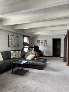 a living room filled with furniture and white walls