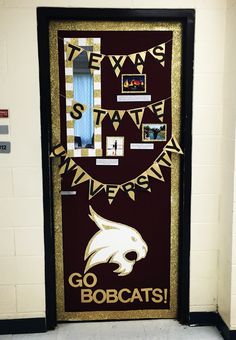 a door decorated with an eagle and the words go bobcats