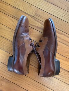 "1970's Florsheim Shoes Lace up front Two tone brown and light brown  Leather sole ,Hard rubber heel Rounded toe with enforced stitching thru out  Great vintage condition lots of life in them ! Size 6 1/2 D Instep -10\" Ball of foot - 4 1/4\"  Heel height -1\" Excellent vintage condition" 70s Mens Shoes, Retro Brown Leather Oxfords, Vintage Oxfords With Leather Footbed And Closed Toe, Vintage Leather Oxfords With Leather Footbed, Vintage Leather Derby Shoes With Leather Footbed, Retro Brown Oxfords With Rubber Sole, Vintage Leather Shoes With Leather Footbed For Derby, Vintage Oxfords With Almond Toe And Leather Footbed, Vintage Oxfords With Leather Sole And Closed Toe