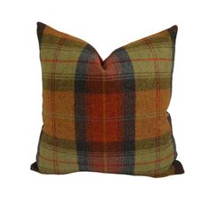 a plaid pillow on a white background