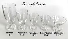 a group of wine goblets with different sizes and shapes