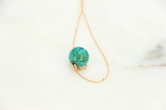 Discover our stunning gold choker necklace with a unique floating round turquoise. 💫💫💫 Yellow Gold Turquoise Necklace With Round Beads As Gift, Elegant Turquoise Necklace With Delicate Chain For Gift, Turquoise Necklace For Everyday Elegance, Elegant Turquoise Necklace For Everyday Wear, Minimalist Turquoise Round Pendant Necklace, Elegant Turquoise Necklace For Everyday, Everyday Turquoise Necklace With Adjustable Chain, Elegant Turquoise Necklace With Birthstone, Minimalist Round Turquoise Jewelry