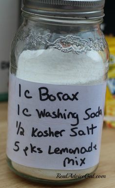 a jar filled with white powder on top of a wooden table