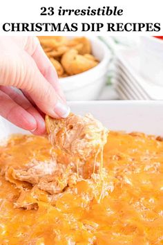 a person dipping cheese into a casserole dish