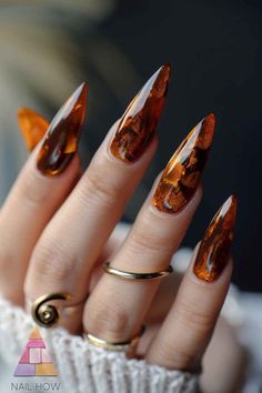 Step up your nail game with these sophisticated brown acrylic nails featuring subtle golden accents. The perfect blend of class and style. Find more nail inspirations at nailhow.com! 💅✨ #AcrylicNails Fall Nails 2024 Brown, Warm Toned Nails, Fall Nails Unique, Gold And Brown Nails, Brown And Orange Nails, Artsy Nails Designs, Brown And Green Nails, Rust Nails, Brown And Gold Nails