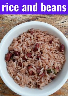 rice and beans in a white bowl on a wooden table with purple text overlay