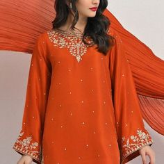 Meticulously crafted from a remarkably glamourous shade of burnt orange ( pure raw silk 58 Gms )“ Minaree “ with its intricate zari details strikes the perfect balance between elegant and eye-catching, making this beautiful design a must have. The length of the long kameez is 46 inches.Agha Noor’s style tip - “ Style w Elegant Embroidered Slub Silk Kurta, Elegant Red Straight Kurta Traditional Wear, Orange Silk Anarkali Traditional Wear, Designer Semi-stitched Orange Kurta, Elegant Slub Silk Traditional Wear With Intricate Embroidery, Elegant Slub Silk Dupatta With Intricate Embroidery, Designer Orange Resham Embroidered Kurta, Orange Traditional Wear With Resham Embroidery In Chinon, Orange Chinon Dupatta With Dabka Work