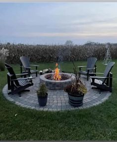 a fire pit with chairs around it