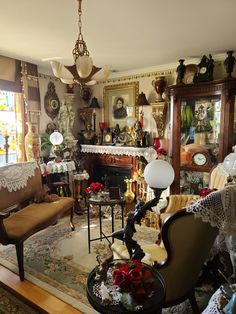 a living room filled with lots of furniture and decor