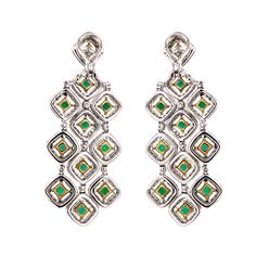 Handcrafted 18 karat white gold chandelier earrings. Square cut green emeralds 7.11 ct from Zambia. Accented with small round white diamonds 5.92 ct. Diamonds are all natural in G-H Color Clarity VS. French / Omega clips. Width: 2.5 cm Height: 6 cm Weight: 34.41 g Luxury Green Diamond Earrings In Sterling Silver, Luxury Green Sterling Silver Diamond Earrings, Green Sterling Silver Luxury Diamond Earrings, Luxury Green Chandelier Earrings, Green Diamond Chandelier Drop Earrings, Luxury Green Dangle Chandelier Earrings, Platinum Bracelet, Gold Chandelier Earrings, Earrings Square