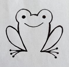 a drawing of a frog sitting on top of a piece of paper