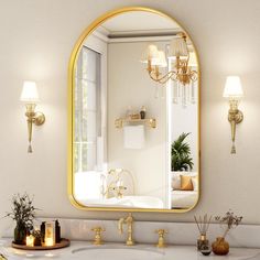 a bathroom with a sink, mirror and lights