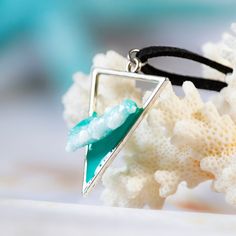 "This unique pendant features a 3D sea wave crafted from resin, breaking within a triangular bezel, reminiscent of the tranquil yet powerful tides at the shore.  A wearable piece of art that captures the essence of the sea. This cute resin jewelry necklace is versatile and suitable for anyone, making it a unique and thoughtful unisex gift idea for ocean enthusiasts. Each ocean wave pendant is unique and no two are alike. So yours will be special. Due to being handmade, the colors may vary slight Turquoise Triangle Jewelry Gift, Turquoise Triangle Jewelry For Gifts, Ocean-inspired Turquoise Resin Jewelry, Wave Pendant, Beach Necklace, Wave Necklace, Sea Wave, Beach Necklaces, Unisex Gift