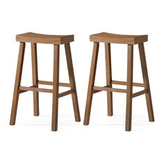 two wooden stools sitting next to each other