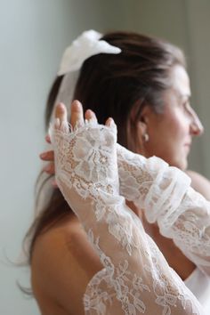 Enhance your wedding ensemble with our luxurious 25-inch bridal sleeves featuring intricate French lace and delicate rose designs. Elevate your look with these 2025 trendsetting statement pieces that exude sophistication and romance. Perfect for any wedding dress, these sleeves will make you stand out on your big day. The timeless beauty of French lace combined with the intricate rose embellishments creates a truly captivating aesthetic that is both feminine and chic. Each sleeve is meticulously Bridal Gloves Long, Rose Embellishments, Wedding Sleeves, Bridal Sleeves, Captivating Aesthetic, Formal Gloves, Wedding Gloves, Bridal Gloves, Lace Gloves