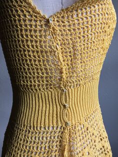 Fitted Knit Vest For Spring, Fitted Crochet Sleeveless Tops, Stretch Sleeveless Crochet Top With Knit Fabrication, Stretch Sleeveless Knit Crochet Top, Fitted Mustard Sleeveless Top, Mustard Fitted Sleeveless Top, Fitted Sleeveless Crochet Top With Knit Fabrication, Fitted Crochet Vest For Summer, Yellow Sleeveless Crochet Lace Top