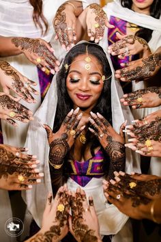 a bride surrounded by her henches and hands