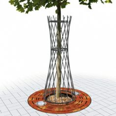 a small tree in a metal planter on a tile floor with an orange circle around it