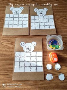 two brown paper bags with teddy bears cut out on them and some other crafting supplies