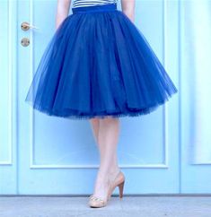 "Beautiful tulle skirt from soft Italian tulle for every day or special occasion. All skirts are made from 4-6 layers tulle, soft lining and elastic waistband for perfect fit and comfort. Each item are handmade and excelent quality. Usually tulle skirt sewing takes about 1 week. Shipping to US - 10 till 14 days, to UK - 5 till 7 days. If you need skirt for a specific date, please write it in the order notes. The model is 5.6ft tall and wears 26\" skirt length (6 layers). The length of the skirt Blue Flared Tulle Skirt, Blue Tulle Party Bottoms, Blue Full Tulle Skirt, Elegant Blue Tutu Dress For Summer, Blue Tulle Bottoms For Spring, Blue Tiered Tulle Skirt Dresses, Spring Blue Tulle Bottoms, Blue Tulle Skirt For Summer, Blue Summer Party Petticoat