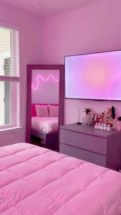 a bedroom with pink walls and purple furniture