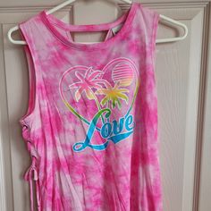 Never Worn. Excellent Condition. Has Strings On Both Sides. Cute Summer Sleeveless Tank Top, Sleeveless Graphic Print Summer Vest, Sleeveless Cotton Tank Top For Beach Season, Pink Sleeveless Summer Top, Cute Spring Sleeveless Vest, Casual Multicolor Vacation Vest, Trendy Sleeveless Tank Top For Beach Season, Casual Multicolor Vest For Vacation, Pink Sleeveless Top For Day Out