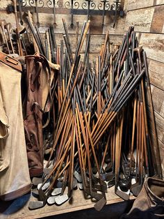 there are many pairs of shoes and canes on display