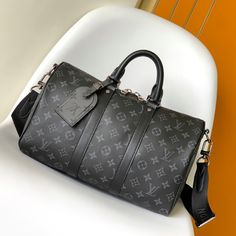 This Keepall Bandoulière 35 handbag uses Monogram Eclipse coated canvas to convey restrained style. The leather top handle, side straps and metal hardware reflect the classic heritage, and the detachable and adjustable shoulder strap makes it comfortable to wear on the shoulder.

Size: 34.0 x 21.0 x 16.0 cm (LxHxW)
• Monogram Eclipse coated canvas
• Calfskin trim
• Textile lining
• metallic parts
• Zip closure
• Removable nameplate
• Dual interior patch pockets
• Shoulder strap: detach Louis Vuitton Yayoi Kusama, Black Louis Vuitton, Louis Vuitton Capucines, Large Cosmetic Bag, Lv Purse, Lv Shoes, Medium Handbags, Louis Vuitton Keepall, Lv Belt