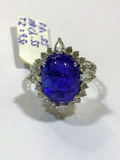 This tanzanite cabochon promise ring or anniversary ring is crafted in solid 18k white gold. The timeless and classic design of this beautiful ring will make your engagement or wedding unforgettable. SETTING :- Gross Weight: 4.054 grams Metal: 18K White Gold (Customisable Also in Yellow Gold - No Extra Charge) Ring Size: 6 (Can be customisable) MAIN STONE :- Gem Type: Natural Tanzanite Weight: 9.50 Carats Shape: Oval Cabochon Color: Rich Royal Blue Clarity: VS ADDITIONAL STONES :- (i) Stone Type Oval Tanzanite Diamond Ring In White Gold, Formal Sapphire Cabochon Rings, Formal Sapphire Rings With Cabochon, Anniversary Platinum Cabochon Ring, Oval Tanzanite Diamond Ring For Anniversary, Sapphire Cabochon Ring For Anniversary, Timeless Tanzanite Rings For Gifts, Timeless Tanzanite Rings As Gift, Fine Jewelry White Gold Cabochon Sapphire Ring