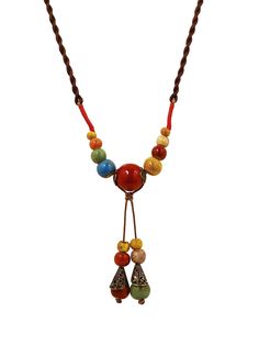 PRICES MAY VARY. Beautiful long boho necklace features a unique combination of ceramic beads in various shapes, sizes and colors Easy to wear on a 31.5 inch (80 cm) braid rope cord which can be adjusted to any length you want Give this stunning piece of bohemian jewelry as a great Valentine's Day, Christmas, birthday, or anniversary gift A nice addition to any jewelry collection that surely makes you stand out from the crowd in style If there is any problem with your purchase, feel free to conta Adjustable Large Beads Hippie Necklace, Hippie Wooden Beads Necklace As Gift, Handmade Red Bohemian Charm Necklaces, Bohemian Long Necklace With Vintage Charm, Bohemian Wooden Bead Pendant Necklace, Antique Key Necklace, Long Necklace Boho, Jewelry Mirror, Ceramic Necklace