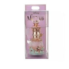 the little mermaid perfume bottle is in its box and it's pink with gold trim