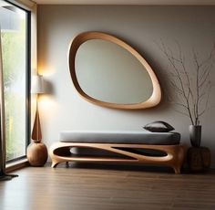 a living room with a round mirror on the wall