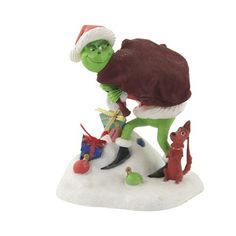 the grinch is riding his bike with santa hat on